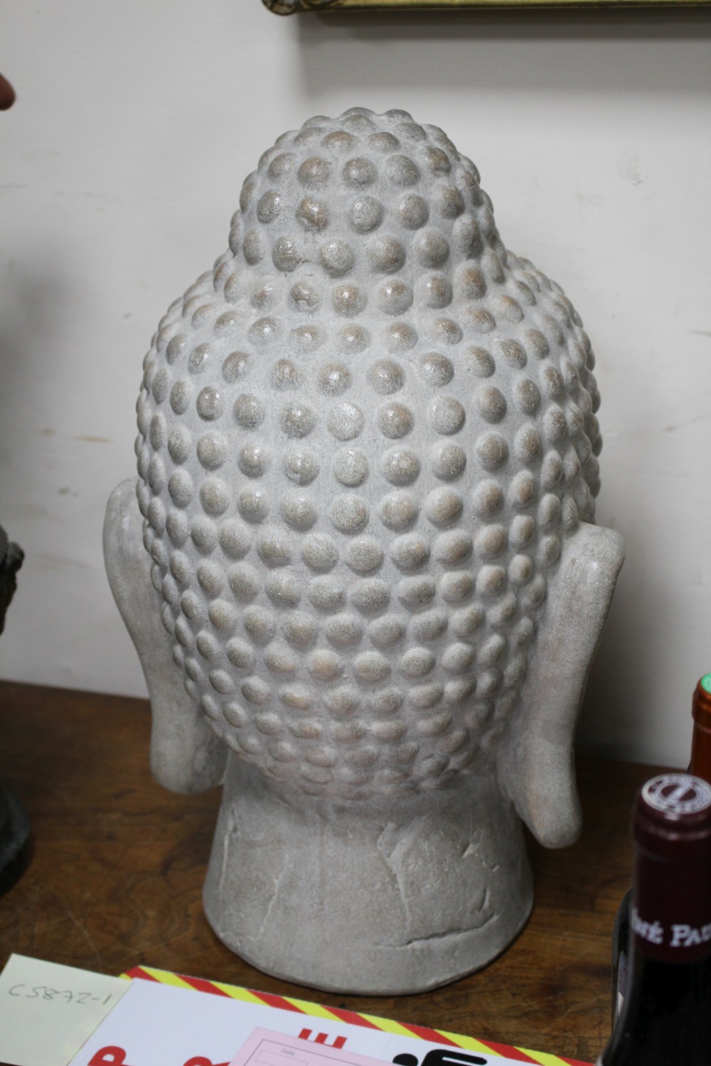 A Far Eastern ceramic Buddha head, height 44cm